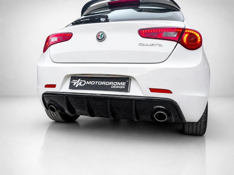 Rear view of a white Alfa Romeo Giulietta with red LED tail lights, badge, and dual exhausts under a black diffuser (Motordrome Design plate).