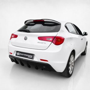 White Alfa Romeo Giulietta rear view in a studio setting, showing taillights and license plate area on the trunk.