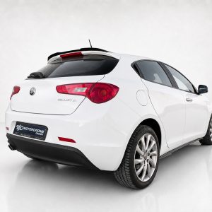 White Alfa Romeo Giulietta seen from the rear-right, parked in a studio backdrop.