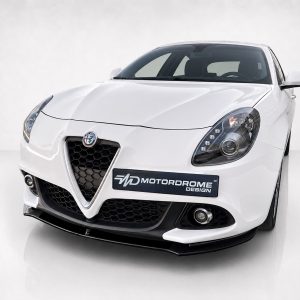 Front three-quarter view of a white Alfa Romeo sports car, showing the distinctive V-shaped grille and honeycomb lower grille with a MotorDrome Design plate.
