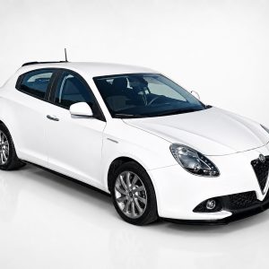 K166-004_2jpg - OPSHOLDERS White hatchback car photographed in a studio, angled to show the front and passenger side.