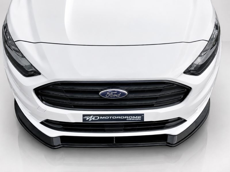 K167-001_3jpg - OPSHOLDERS Front view of a white Ford car with a black grille and Ford emblem on the front bumper area with a glossy finish.