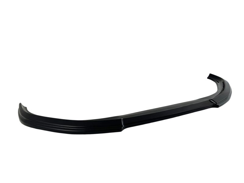 Black curved car spoiler/lip stretched across a white background, shown from a side angle (automotive part)