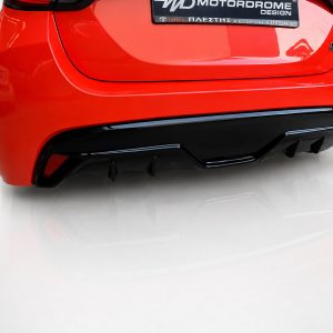 K169-003_2jpg - OPSHOLDERS Red car rear end with a black diffuser and glossy bumper; license plate area visible above the diffuser.