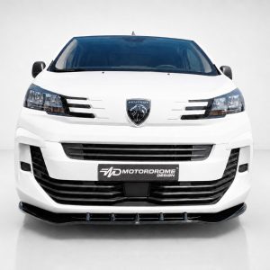 Front view of a white Peugeot van facing the camera, with the emblem centered and headlights visible in a studio setting.