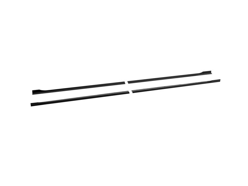 Four black elongated trim strips with slight curvature laid diagonally on a white background.