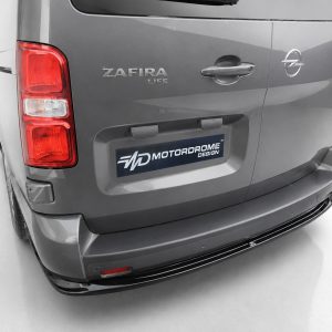 Rear view of a gray Opel Zafira Life with a MotorDROME Design license plate on a white studio background.