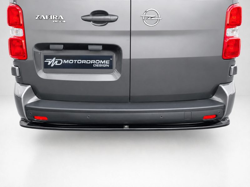 Rear view of a gray van with split doors, showing Zafira Life and Opel badges and a Motordrome Design plate above the bumper.