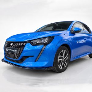Blue Peugeot sedan in a bright studio, front grille visible and 'SCAN & DRIVE' text on the side.