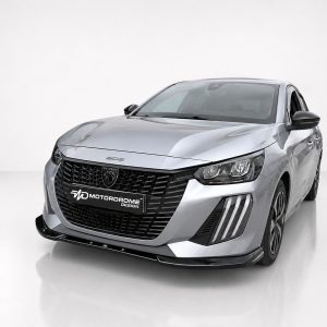 Silver Peugeot sedan with a bold black grille and logo, angled front view in a bright studio setting showing the Motordrome Design plate