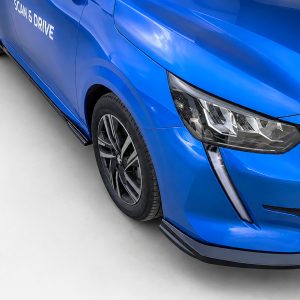Close-up of a glossy blue car showing the front headlight, wheel, and 'Scan & Drive' text on the door section.