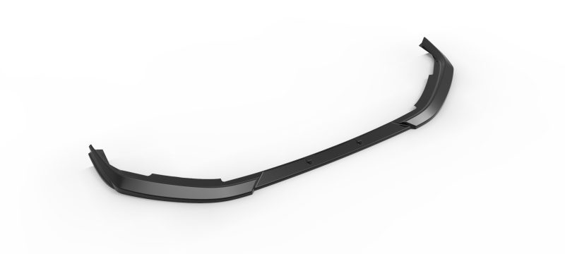 Long black curved car bumper lip spoiler lying on a white surface, showing mounting edges and aerodynamic shape.