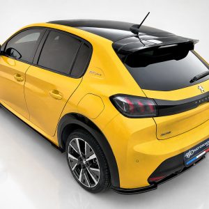 Rear three-quarter view of a yellow Peugeot 2008 GT Line SUV with a black roof and large alloy wheels, in a studio setting behind the car's taillights visible.
