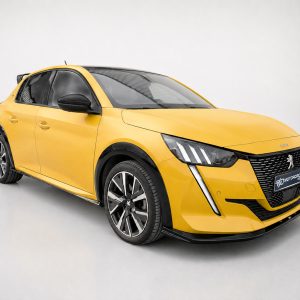 Yellow Peugeot hatchback shown in a studio, angled to highlight the front left side and grille (3/4 view).