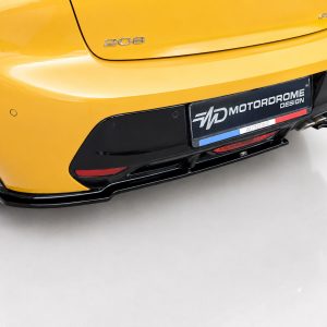 Rear view of a bright yellow car showing the 208 badge and black lower bumper with a custom MotorDrome Design plate