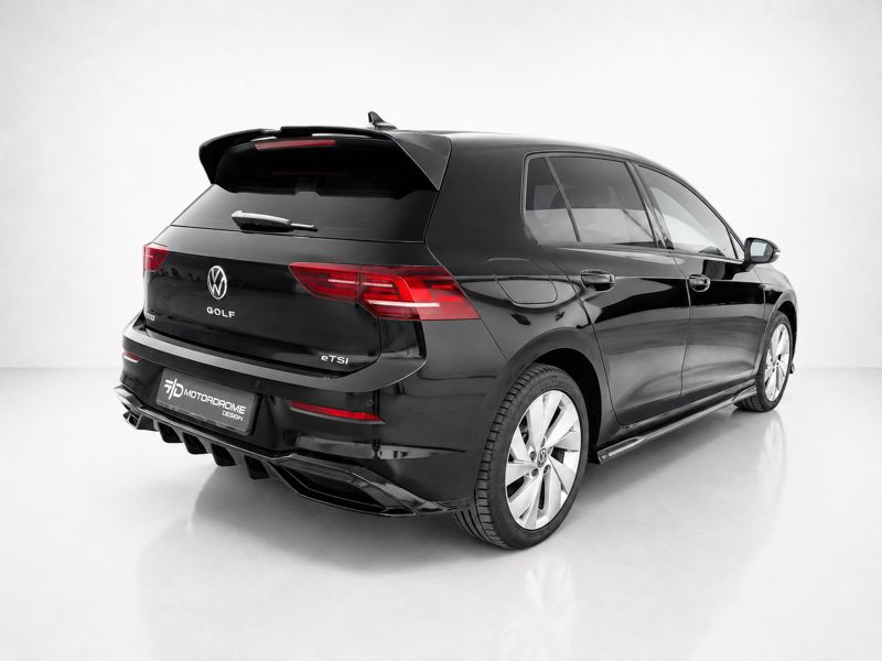 Black Volkswagen Golf eTSI station wagon viewed from rear-right in a white studio setting