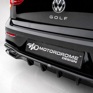K174-004_4jpg - OPSHOLDERS Rear view of a glossy black VW Golf showing a Motordrome Design license plate and sporty rear bumper/diffuser