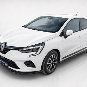 White Renault hatchback photographed at a slight angle, showing the front grille and headlights.