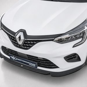 White Renault car front with prominent diamond logo and black grille, angled view showing headlight and bumper detail