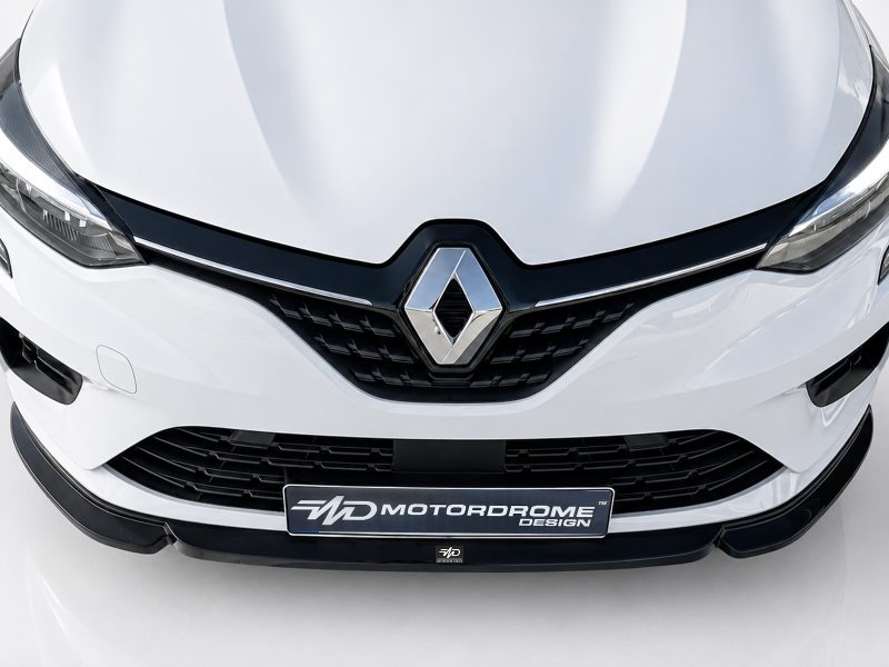 Front view of a white Renault car showing the grille and diamond emblem prominently centered