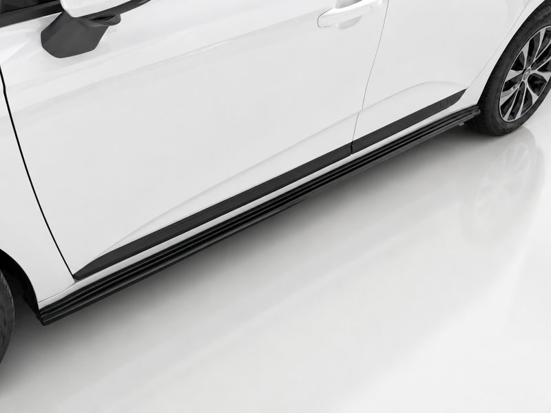 Side view of a white car showing a black running board and alloy wheel on the right side of the image.