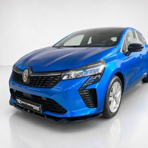 Blue Renault hatchback shown from the front-left in a white studio setting.