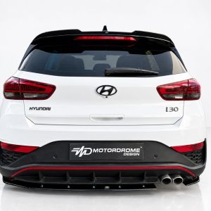 Rear view of a white Hyundai i30 with a black rear bumper and red taillights; MD Motordrome Design plate visible on bumper