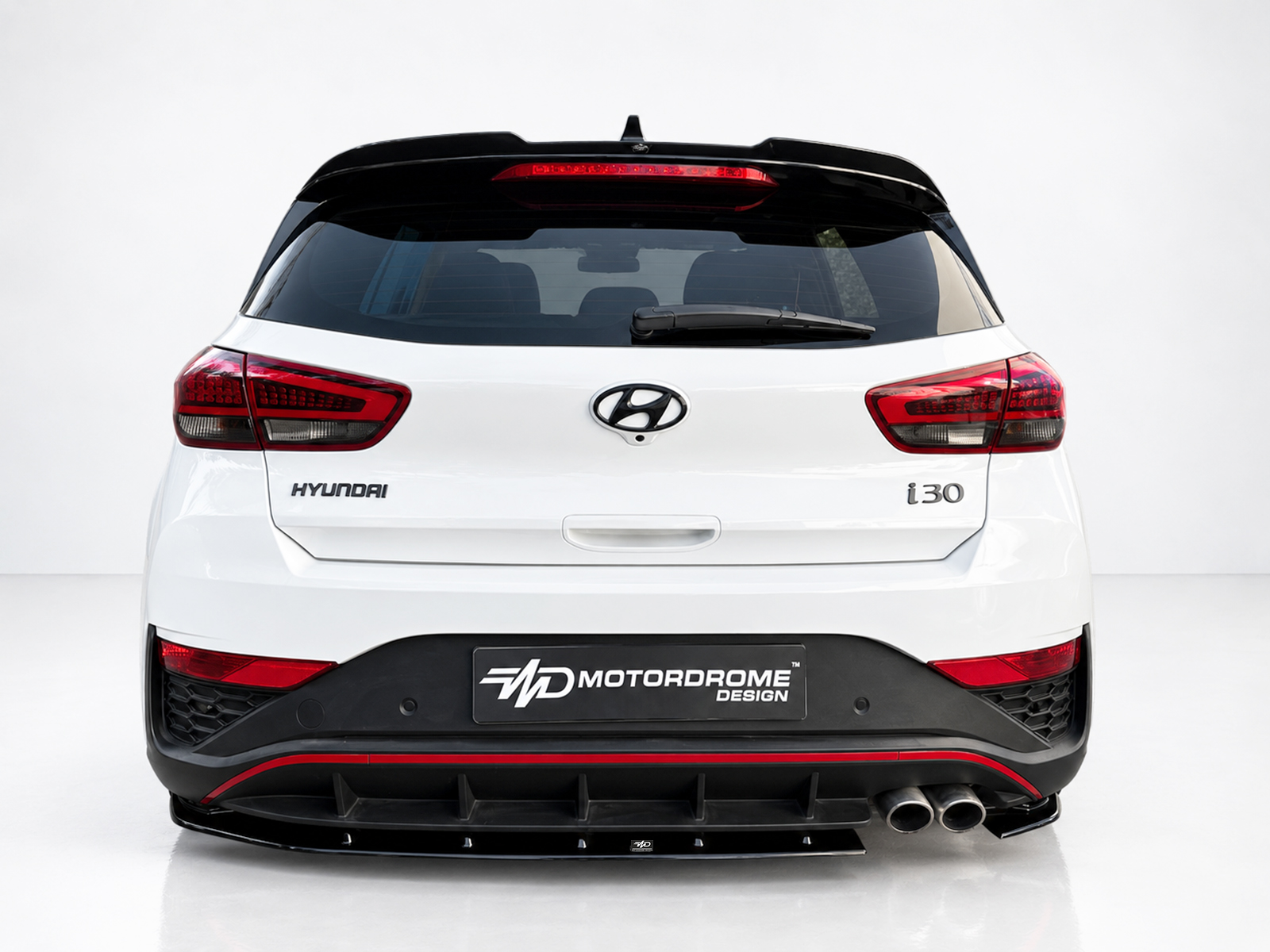 K180-002_1jpg - OPSHOLDERS Rear view of a white Hyundai i30 with a black rear bumper and red taillights; MD Motordrome Design plate visible on bumper