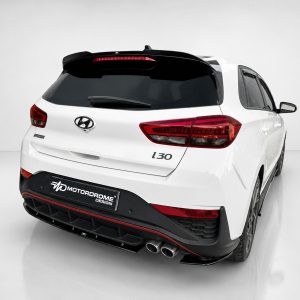 K180-002_2jpg - OPSHOLDERS Rear-right three-quarter view of a white Hyundai i30 hatchback with dark windows and red taillights in a studio setting.