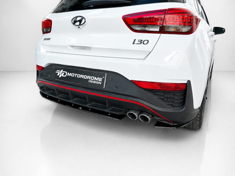 K180-002_3jpg - OPSHOLDERS White Hyundai i30 with a black Motordrome Design rear aero bumper and dual exhausts, photographed from the back left corner
