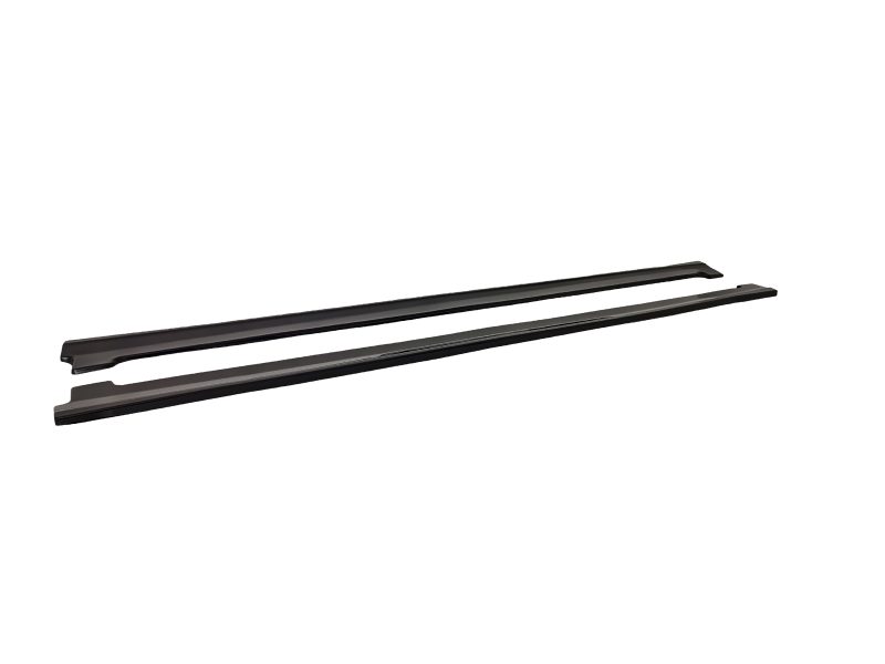 Two black roof rack rails laid parallel, likely part of a car roof rack system