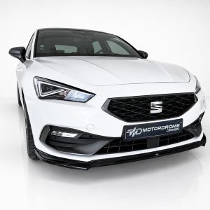 White car shown from the front-left angle, featuring a black grille and distinctive headlight design, on a clean studio backdrop.
