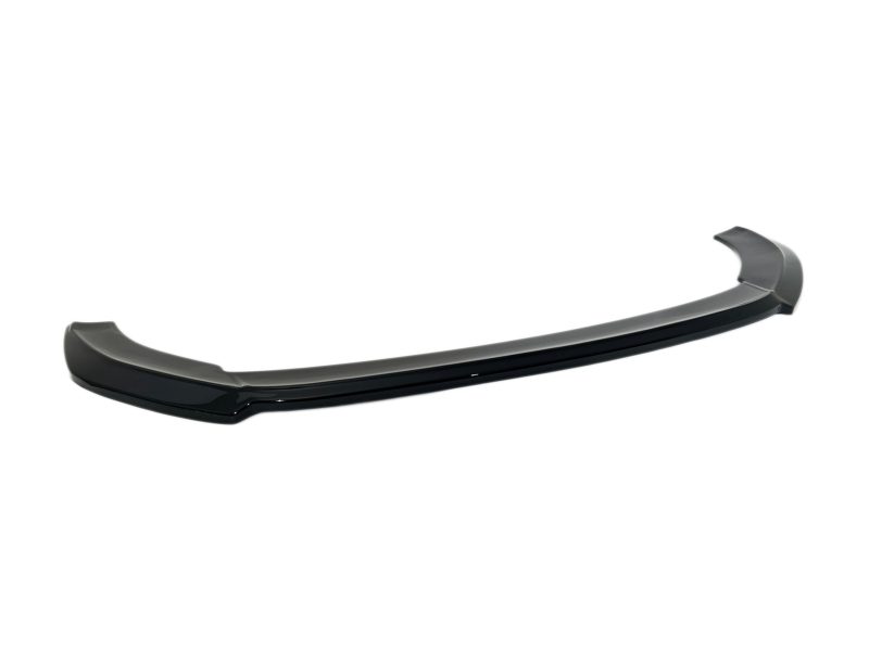 Glossy black car spoiler with a long curved rear wing for aerodynamics amnd styling.