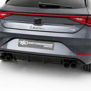 Rear view of a gray SEAT Leon hatchback with a red taillight strip, 'Leon' badge, and dual exhausts; Motordrome Design plate visible on the bumper