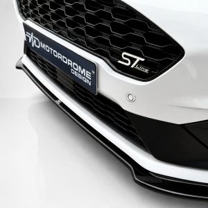 K182-001_4jpg - OPSHOLDERS Close-up of a white car front with a black honeycomb grille, featuring an ST Line badge and a blue plate with text.