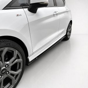 Close-up of a white car's side, featuring a large alloy wheel, front fender, and ST-Line badge near the door.