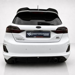 White Ford hatchback rear with a large black spoiler and dark taillights, showing a branded plate area to emphasize styling kit and performance branding.
