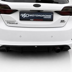 Rear view of a white Ford car with Fiesta badge on the left and ST-Line badge on the right, featuring a Motordrome Design plate in the center.