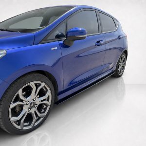 K182-005_2jpg - OPSHOLDERS Blue hatchback shown from the front-left side with alloy wheels and a sleek mirror. (informative)