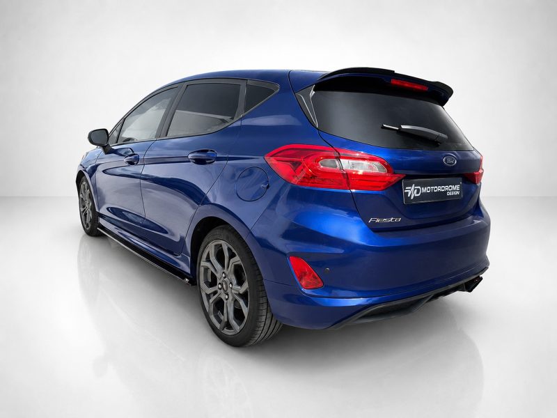 K182-005_3jpg - OPSHOLDERS Blue Ford Fiesta hatchback viewed from the rear-left in a white studio setting
