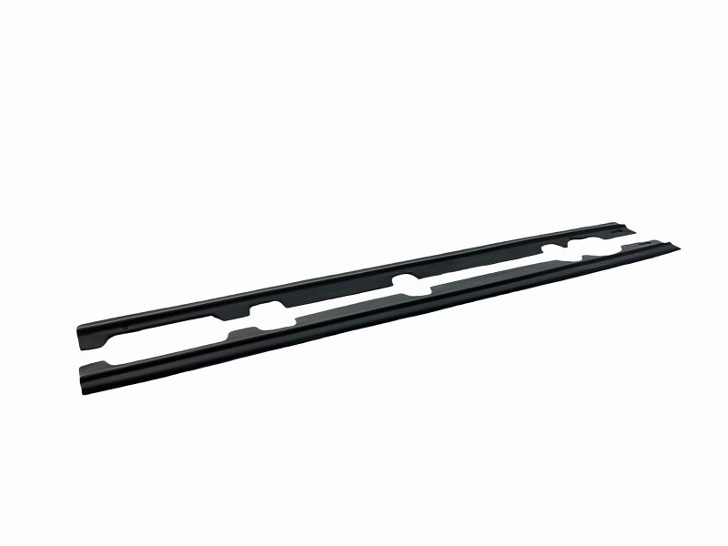 K182-005_5jpg - OPSHOLDERS Pair of long black automotive rails with scalloped mounting slots on a white background