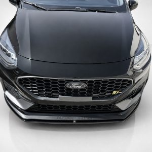Front view of a dark gray Ford car, showing the bold honeycomb grille and Ford emblem.
