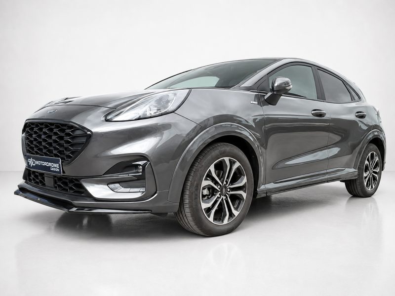 Gray crossover SUV in a studio setting, front-left three-quarter view highlighting the bold grille and alloy wheels.
