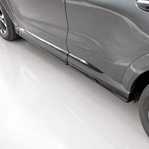 Close-up of a gray SUV showing chrome side steps along the lower body rimmed with shiny trim, photographed from the side.