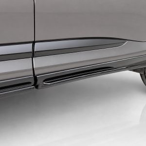 Close-up of a dark gray SUV's lower door panels with a chrome running board and tire visible on the right side.
