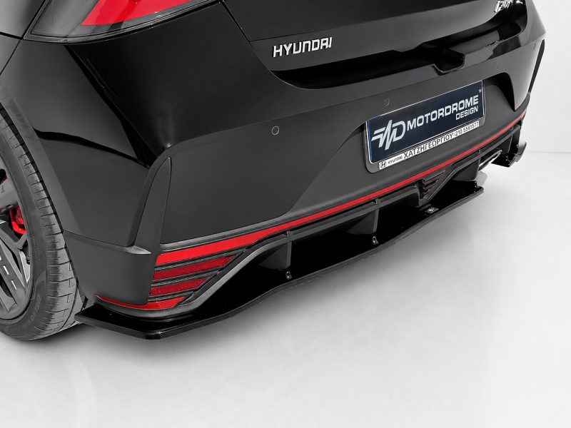 K185-003_3jpg - OPSHOLDERS Rear of a black Hyundai with red accents, showing a performance diffuser and taillights on a clean studio setup.