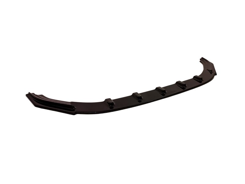 Long black automotive diffuser/spoiler lip with mounting clips for installation along the underside of a vehicle's bumper