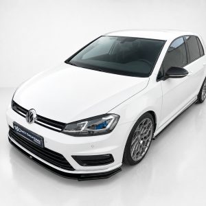 Front-left view of a white Volkswagen hatchback in a clean studio setting, showcasing its sleek lines and alloy wheels