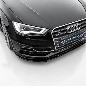 Black Audi S3 front view with chrome grille, four-ring emblem, and Motorbrome Design plate.