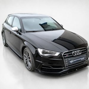 Black Audi sedan shown in a angled front-left view, chrome grille, and alloy wheels on a light background.